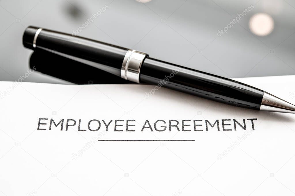 Managers and union reps agreeing terms at a table